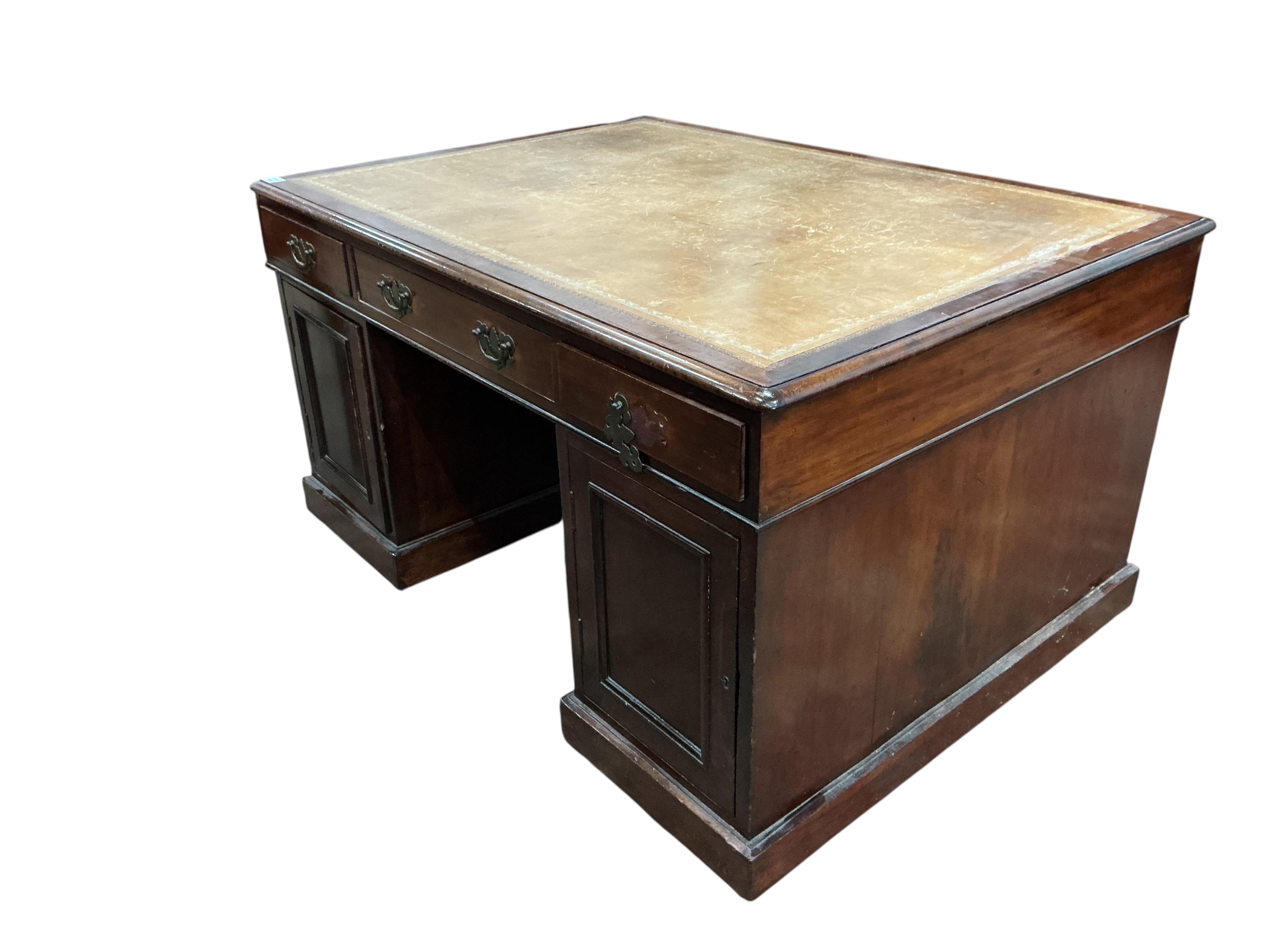 A late Victorian mahogany pedestal partner's desk, width 136cm, depth 99cm, height 78cm